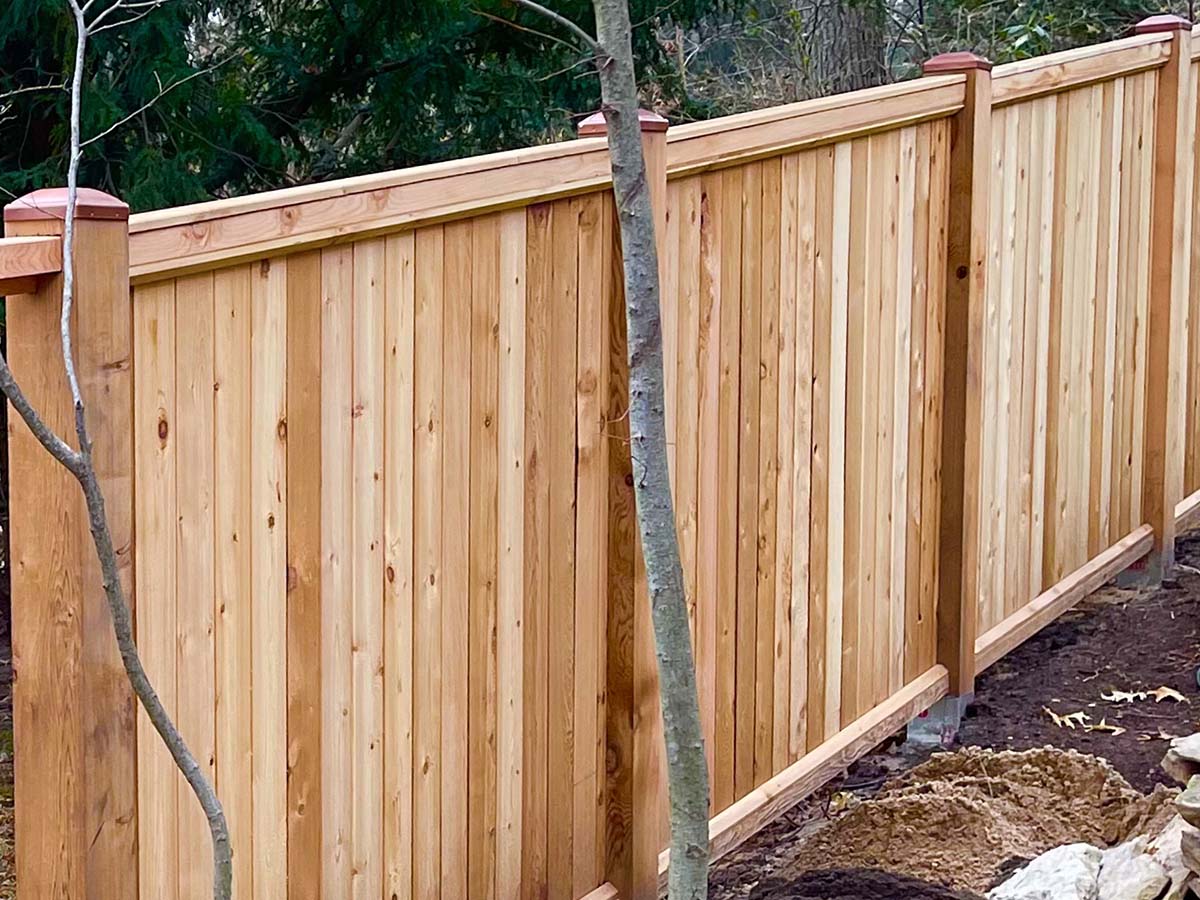 Kouts IN cap and trim style wood fence